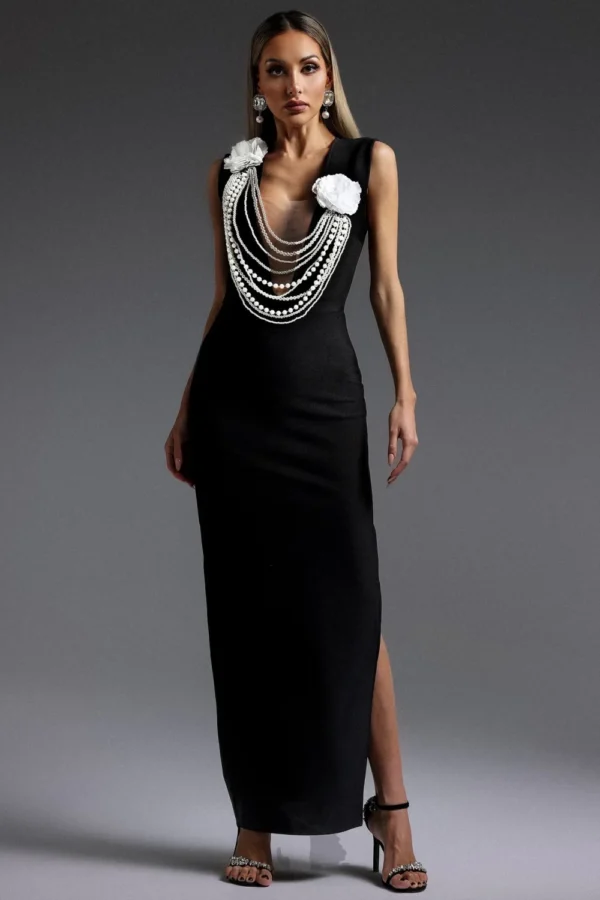 Rochie eleganta neagra confectionata din material tip bandage accesorizata cu siruri de perle la bust